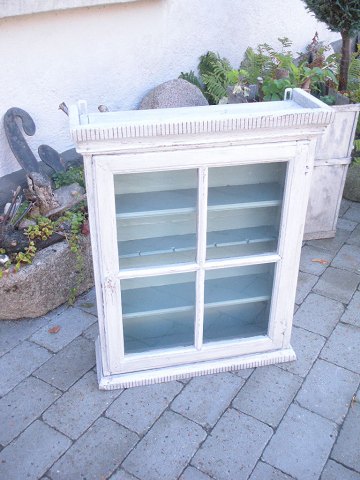 gray-painted display cabinet