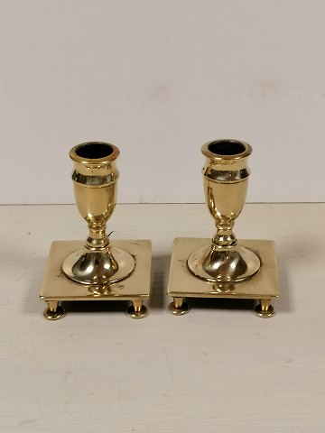 A pair of miniature candlesticks of brass baroque 
shape