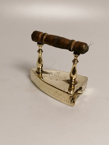Small brass iron dated 1828