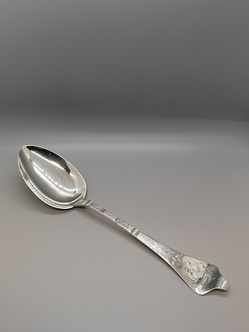 Antique Rococo serving spoon made of three-tower 
silver