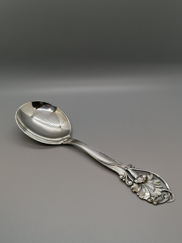 Serving spoon of three-tower silver