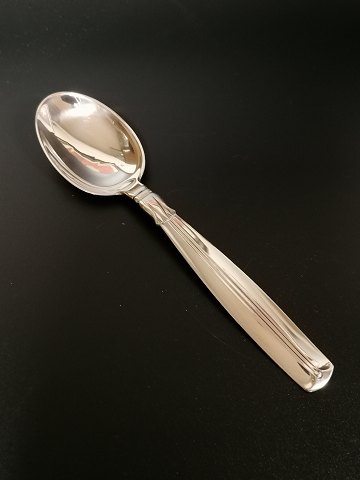 Lotus dessert spoon of three-towered silver