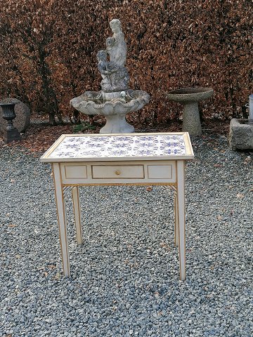 Tile table with 15 softly decorated tiles on tendon frames