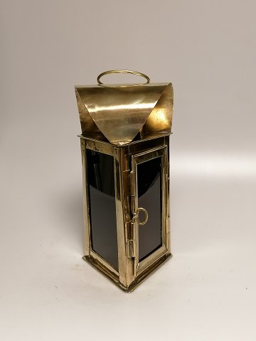 Brass lantern with red glass