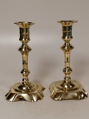 A pair of stamped brass baroque candlesticks