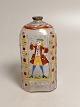 Enamel decorated brandy bottle