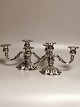 A pair of three-armed candlesticks of three-tower silver COHR