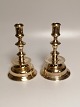 A pair of brass candlesticks at the end of the 18th century.