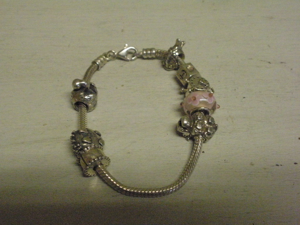 Kig-Ind Antik - armbånd med 8 charms sterling sølv